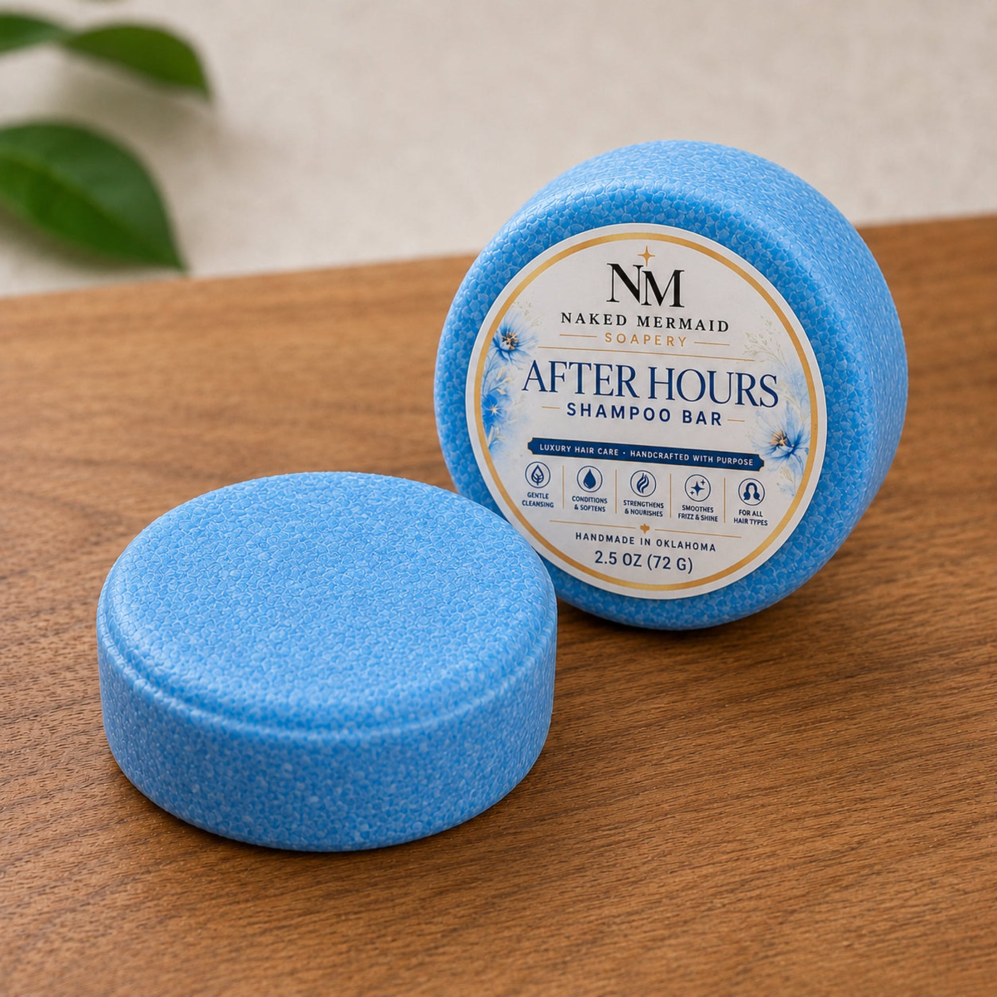 After Hours solid shampoo bar by Naked Mermaid Soapery, featuring one labeled blue shampoo bar standing upright and one unlabeled bar lying flat on a wood surface.