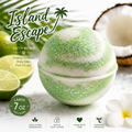 A large round bath bomb labeled 'Island Escape' with green and white marbled glitter, shown with limes, a coconut half, and a white flower on a light background. 