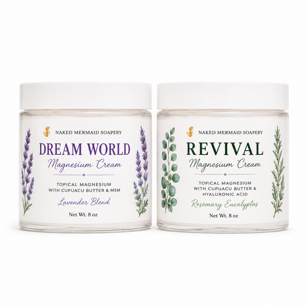 Two Naked Mermaid Soapery magnesium cream jars on a white background: Dream World Lavender Blend on the left with purple text and lavender illustrations, and Revival Rosemary Eucalyptus on the right with green text and eucalyptus illustrations.