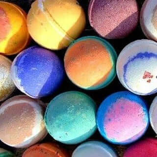 Bath bombs using all natural ingredients. Made using shea butter, milk powder and skin safe colorants.