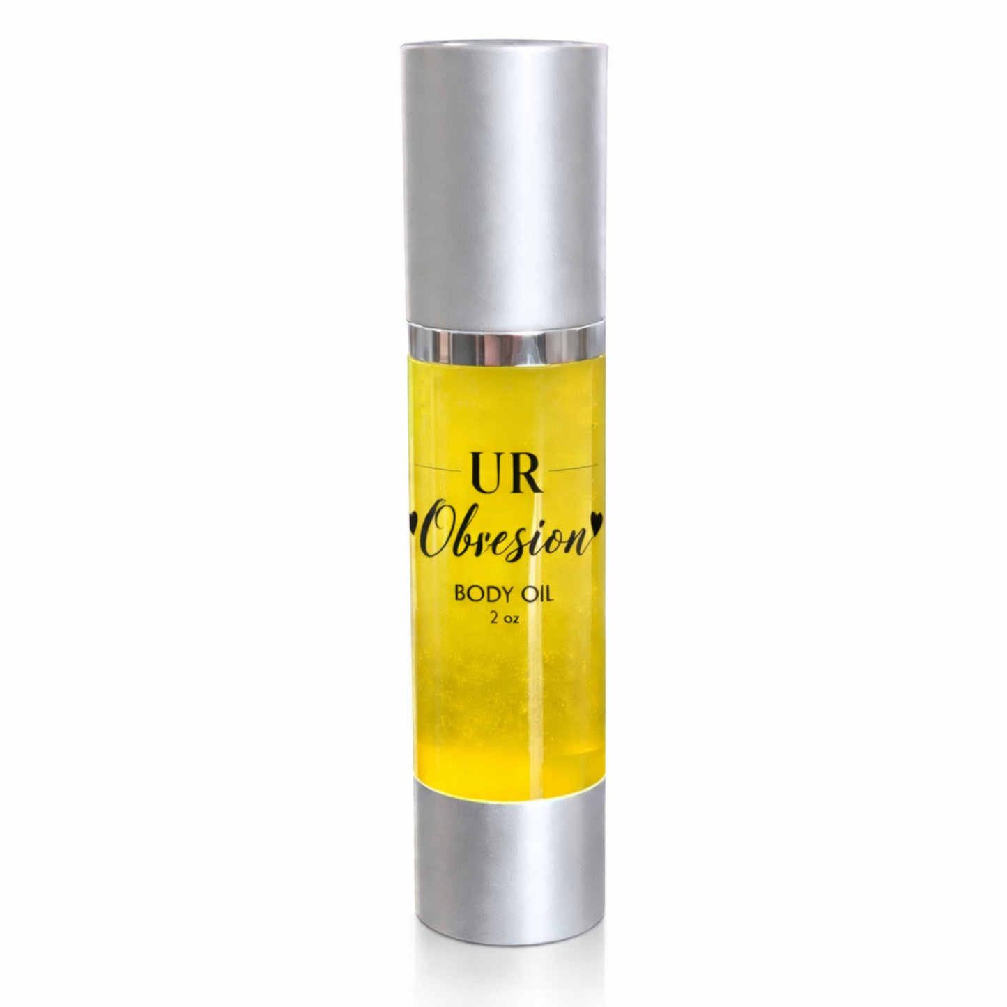 UR Obsession 2 oz body oil in a clear airless pump bottle with silver cap and base, featuring a clear label with black text and filled with golden jojoba, amla, rosehip, and vitamin E oils on a clean white background.