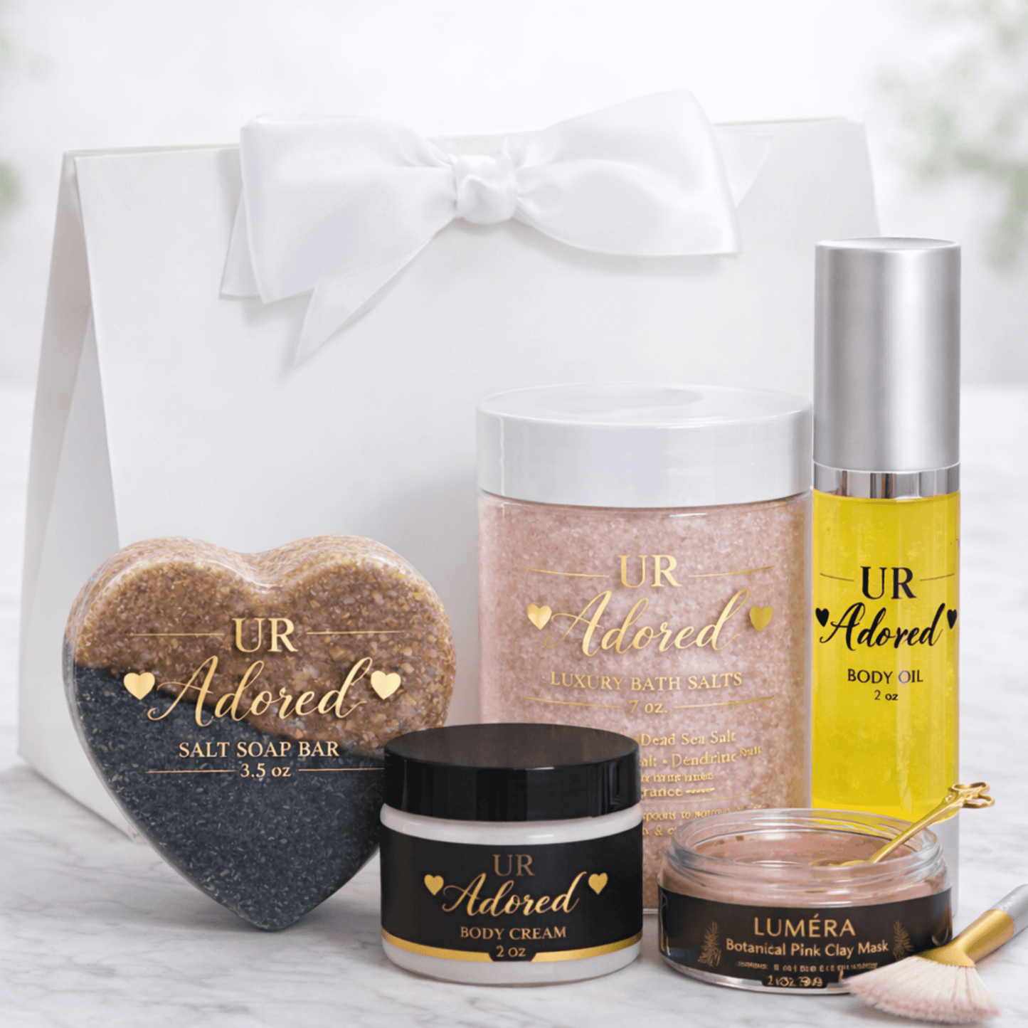 UR Adored luxury skincare gift set with body cream, bath salts, soap bar, body oil, Luméra clay mask, scented in Cheriso 76 fragrance.